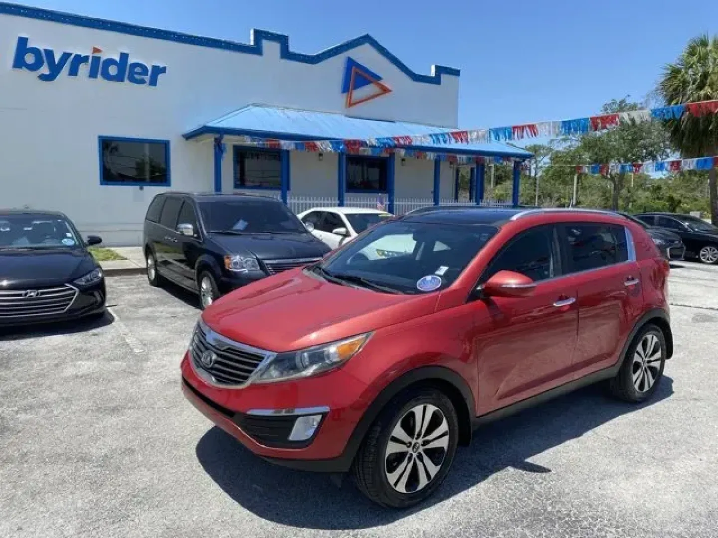 2013 Kia Sportage (KNDPC3A24D7) with an Other engine, AUTOMATIC transmission, located at 8829 US Hwy 19, Port Richey, FL, 34668, (727) 264-1107, 28.285917, -82.717346 - IIHS Top Safety Pick. Boasts 30 Highway MPG and 21 City MPG! This Kia Sportage delivers a Gas I4 2.4L/144 engine powering this Automatic transmission. SIGNAL RED, EX PREMIUM PKG -inc: leather seat trim, dual heated front seats, cooled driver seat, push-button start w/smart key, panoramic sunroof, au - Photo#0