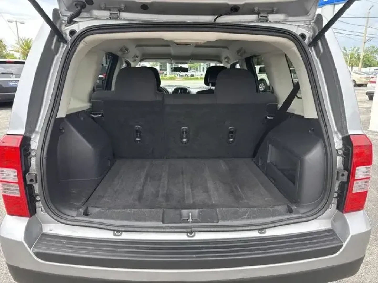 2014 Jeep Patriot (1C4NJPBA1ED) with an Other engine, AUTOMATIC transmission, located at 1285 Cassat Ave, Jacksonville, FL, 32205, (904) 425-3000, 30.299780, -81.732430 - KBB.com 5-Year Cost to Own Awards. This Jeep Patriot boasts a Regular Unleaded I-4 2.0 L/122 engine powering this Automatic transmission. ENGINE: 2.0L I4 DOHC 16V DUAL VVT (STD), Variable intermittent wipers, Touring suspension.*This Jeep Patriot Comes Equipped with These Options *Strut Front Suspen - Photo#7