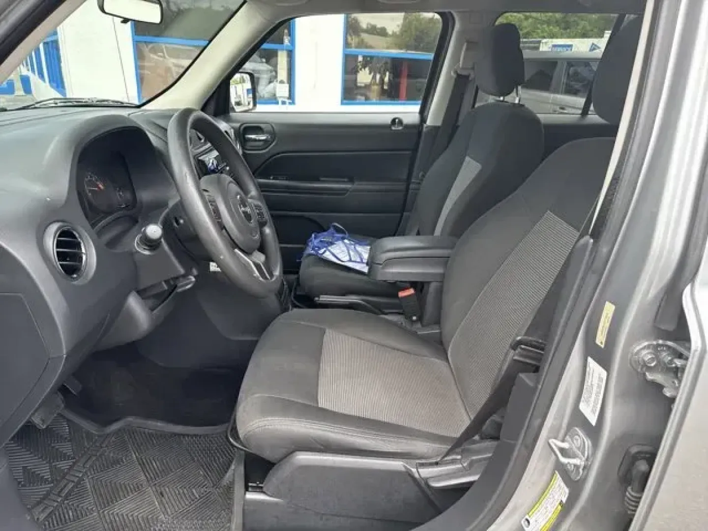 2014 Jeep Patriot (1C4NJPBA1ED) with an Other engine, AUTOMATIC transmission, located at 1285 Cassat Ave, Jacksonville, FL, 32205, (904) 425-3000, 30.299780, -81.732430 - KBB.com 5-Year Cost to Own Awards. This Jeep Patriot boasts a Regular Unleaded I-4 2.0 L/122 engine powering this Automatic transmission. ENGINE: 2.0L I4 DOHC 16V DUAL VVT (STD), Variable intermittent wipers, Touring suspension.*This Jeep Patriot Comes Equipped with These Options *Strut Front Suspen - Photo#9