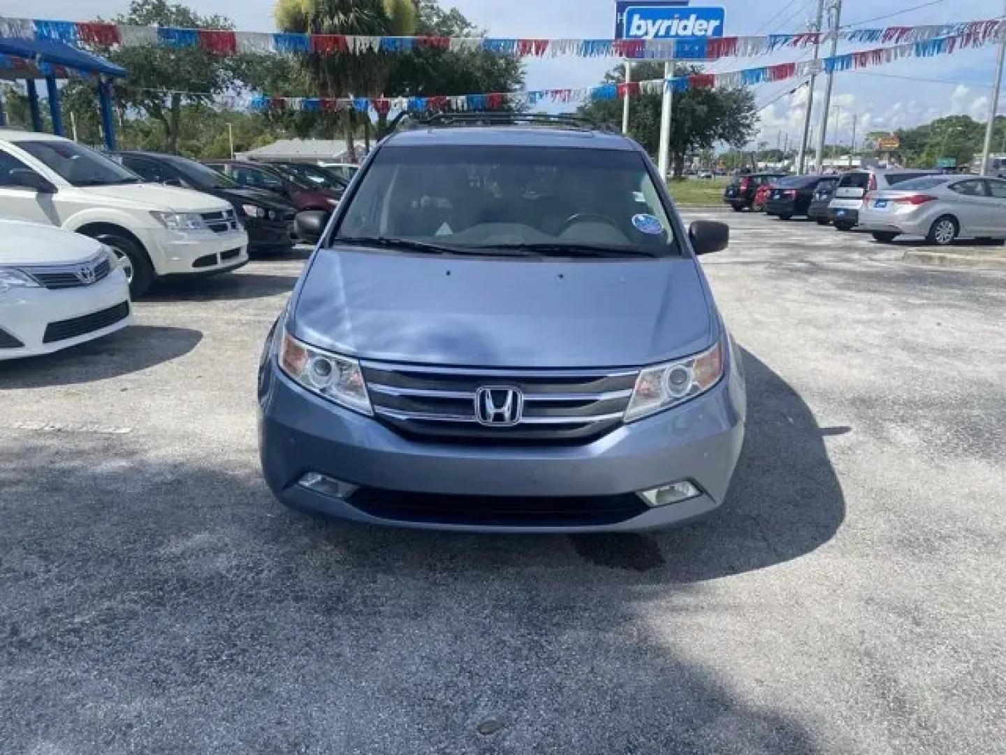 2012 Honda Odyssey (5FNRL5H9XCB) with an Other engine, AUTOMATIC transmission, located at 8829 US Hwy 19, Port Richey, FL, 34668, (727) 264-1107, 28.285917, -82.717346 - **Discover Your Family Adventure with the 2012 Honda Odyssey at Byrider Florida #162!**<br /> <br /> Are you ready to elevate your family outings and daily commutes? The 2012 Honda Odyssey, available now at Byrider Florida #162 in Port Richey, FL, is the perfect vehicle for growing families or anyon - Photo#1
