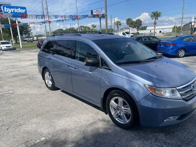 2012 Honda Odyssey (5FNRL5H9XCB) with an Other engine, AUTOMATIC transmission, located at 8829 US Hwy 19, Port Richey, FL, 34668, (727) 264-1107, 28.285917, -82.717346 - **Discover Your Family Adventure with the 2012 Honda Odyssey at Byrider Florida #162!**<br /> <br /> Are you ready to elevate your family outings and daily commutes? The 2012 Honda Odyssey, available now at Byrider Florida #162 in Port Richey, FL, is the perfect vehicle for growing families or anyon - Photo#2